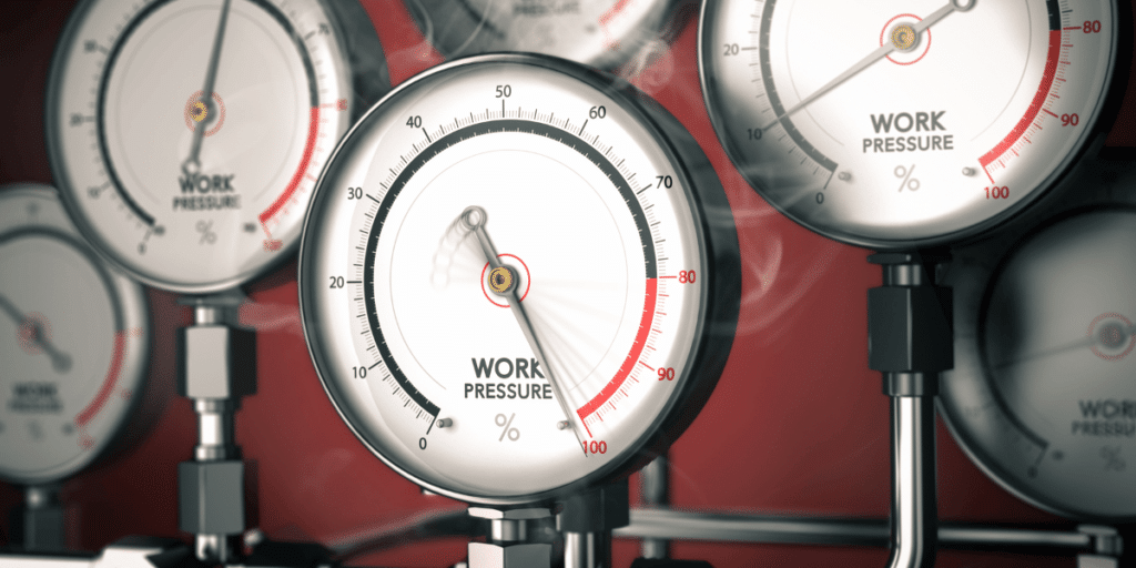 Work-life balance after 40: A pressure gauge with 'Work pressure' written off symbolizing the increased pressure faced by those over 40.